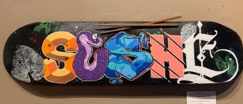 sushi-tampa-graffiti-artist-sushi-skateboard-letters-scaled.jpg