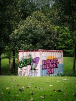 free-photo-of-graffiti-container-in-green-park-setting.jpeg