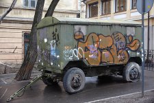 pngtree-rusty-tank-flat-tires-military-green-graffiti-photo-image_3796547.jpg