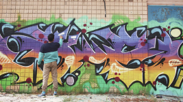 videoblocks-young-man-graffiti-artist-painting-on-the-wall-exterior_rjgbqcjocm_thumbnail-1080_05.png