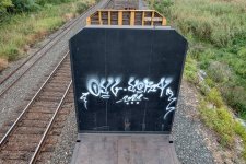 free-photo-of-graffiti-on-a-wall-by-the-railway.jpeg